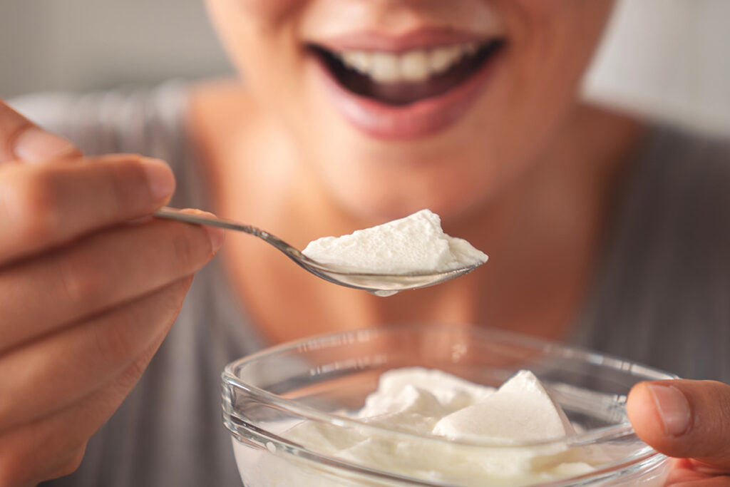 yogurt eating woman