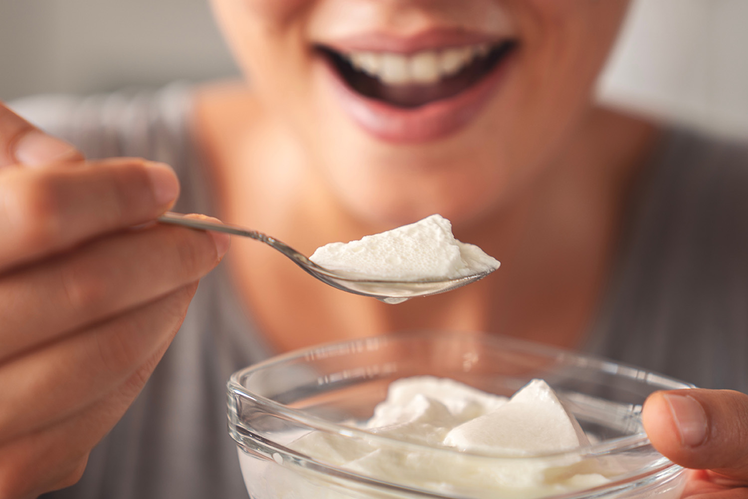 yogurt eating woman